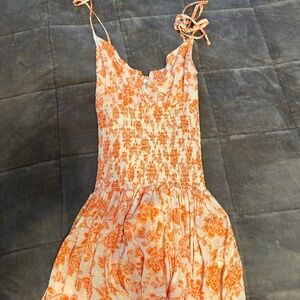 isabelles cabinet the girl next door orange dress